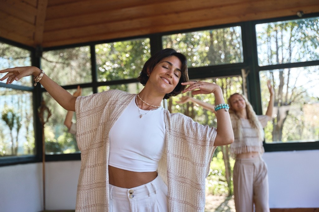 Participants in a mindful movement session in a bright studio